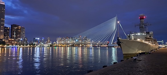 HMS Richmond lit up at night in Rotterdam