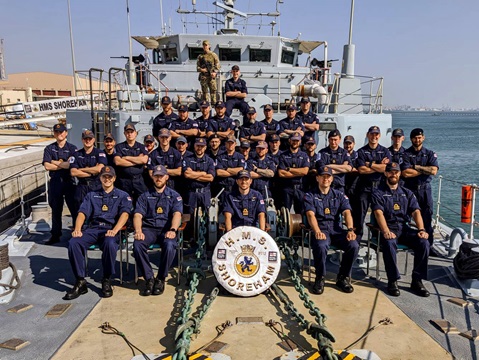 HMS Shoreham Crew 5 pose on the forecastle