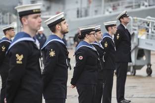 Members of ship's company welcome HMS Spey alongside