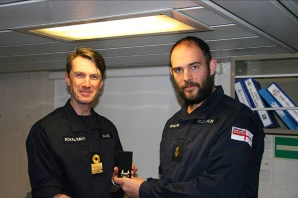 Commodore presents awards to sailors of HMS Tyne