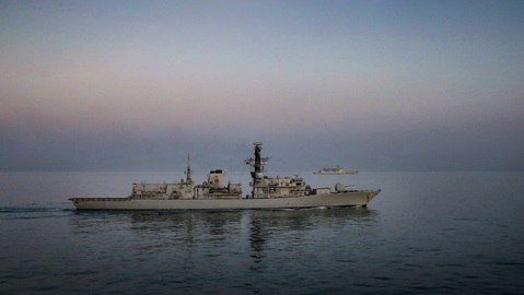 HMS Westminster (foreground) escorts the Chinese destroyer Xian