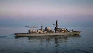 HMS Westminster (foreground) escorts the Chinese destroyer Xian