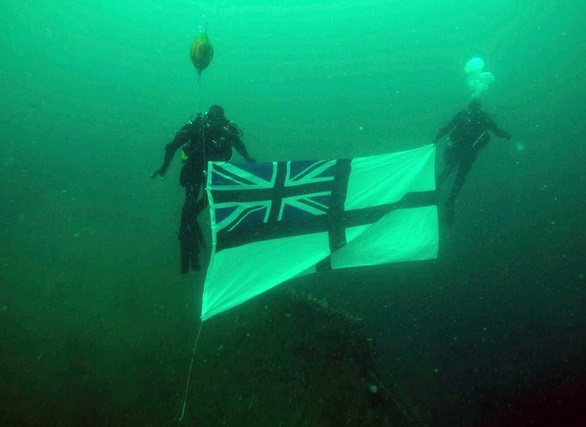 Northern Diving Group divers replace the White Ensign on the wreck of HMS Royal Oak.jpg