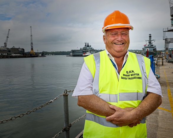 Wharfmaster Dave Trigger with tugs in the background manoeuvring HMS Albion