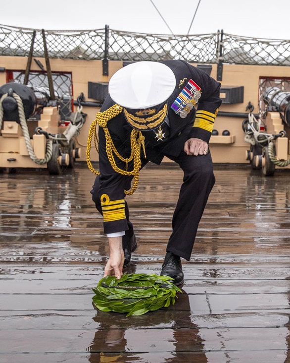 Second Sea Lord Nick Hine CB lays a wreath on the deck of HMS VICTORY over the spot where Lord Nelson fell