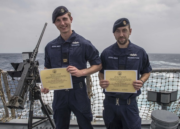 Royal Navy sailors AB Lawrence Hepworth and AB Nicholai Higginbotham on board USS Carney