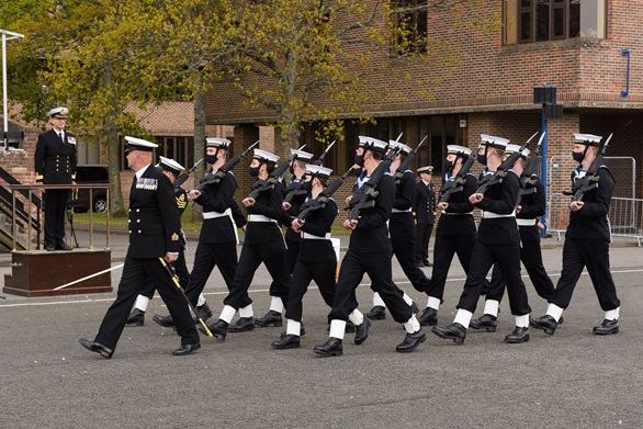 The recruits of Perkins Division march past Commodore Simon Huntington