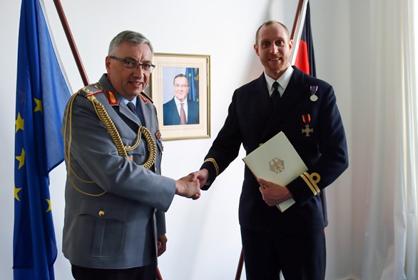 Defence Attaché Brigadier General Michael Oberneyer presents Lt Read with his Ehrenkreuz