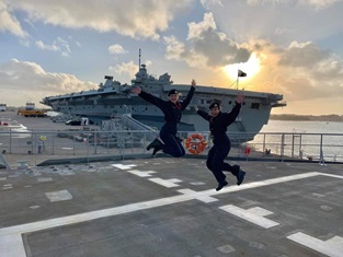 Personnel jumping on a flight deck